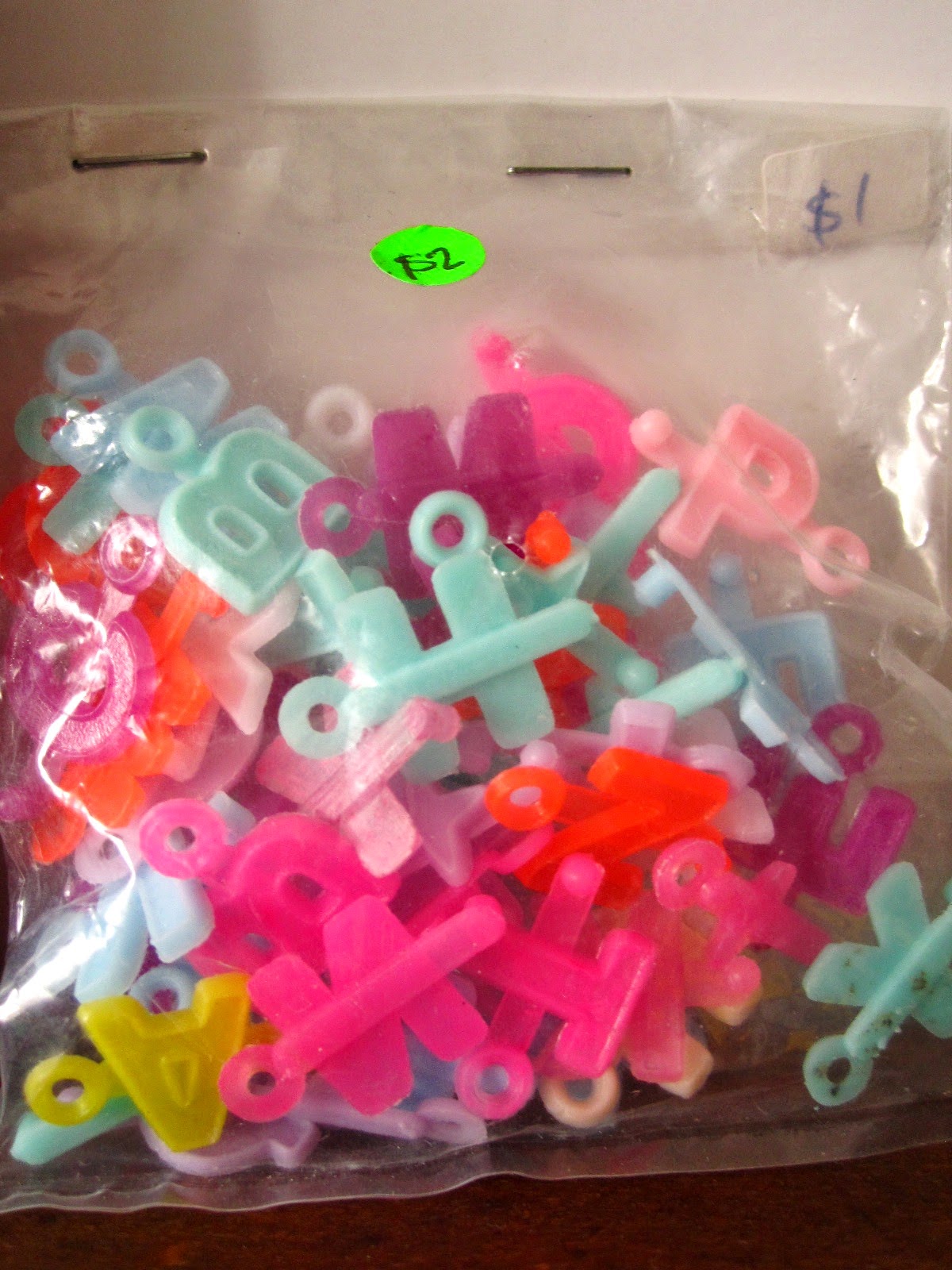 Bag of colourful plastic  pop-bead letters.