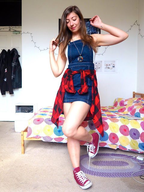Spring Sunshine - outfit of denim dungaree dress, white top, red & black flannel checked shirt around the waist, and red Converse