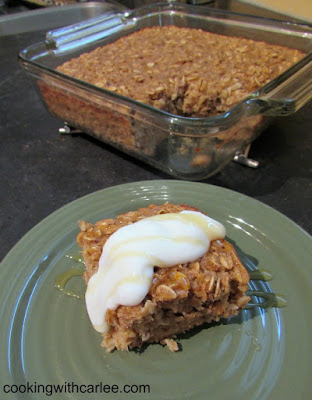 This banana bread baked oatmeal has all of the flavor of banana bread in a healthier for you baked oatmeal form. It is an easy breakfast that can be made on the weekend and reheated throughout the week! #SundaySupper piece of banana bread baked oatmeal served with remaining dish in background