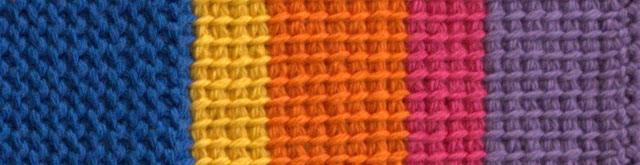 a strip of tricot fabric in rainbow colours.