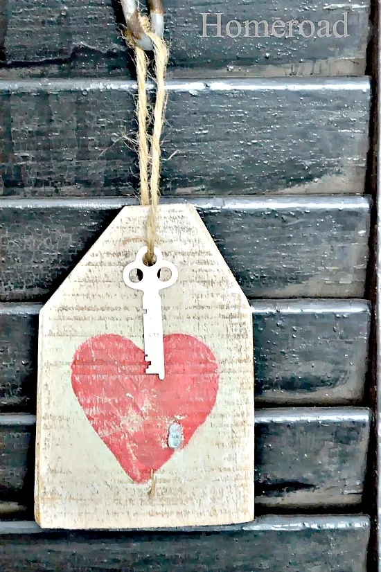 wooden heart with key and heart on shutter