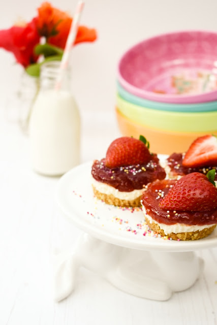 Mini no-bake strawberry cheesecakes Mini no-bake strawberry cheesecakes topped with half a strawberry & spinkles