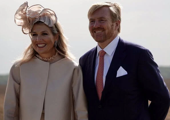 King's Commissioner, Mrs. Jetta Klijnsma. Queen Maxima wore a blouse and trousers by Natan. Hale Bob dress