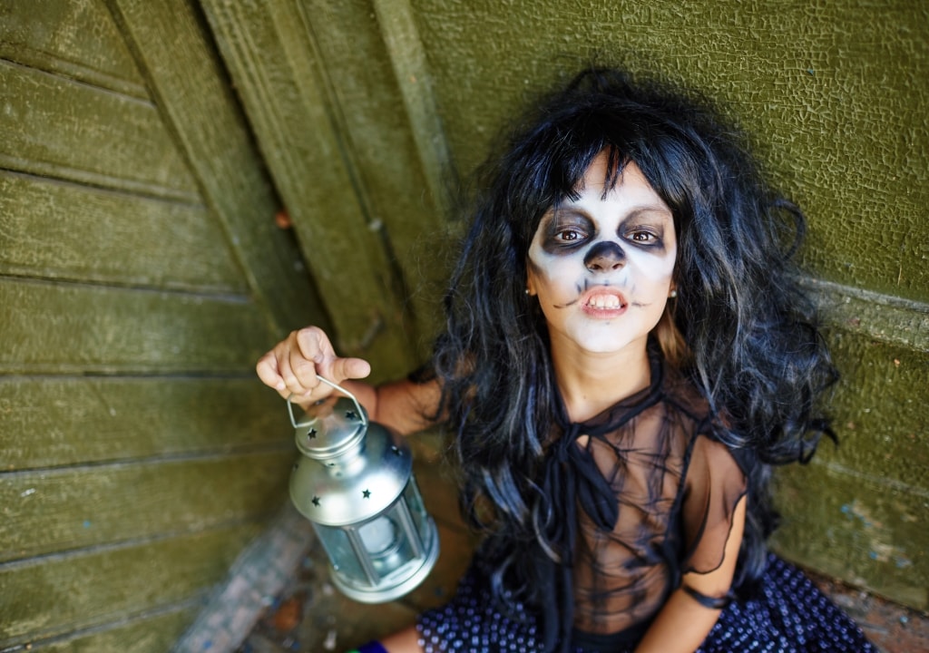 Halloween girl with jack o lantern