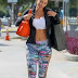 Mother of 5 Nicole Murphy flaunts her trim frame in crop tops and tight pants as she leaves the gym 