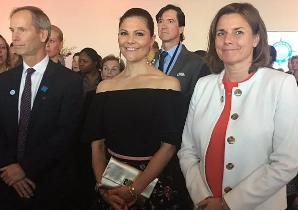 Crown Princess Victoria and Prince Albert of Monaco attended the "Ocean Conference. Princess Victoria wore  floral printed skirt. carried Anya Hindmarch Gold Metallic Clutch