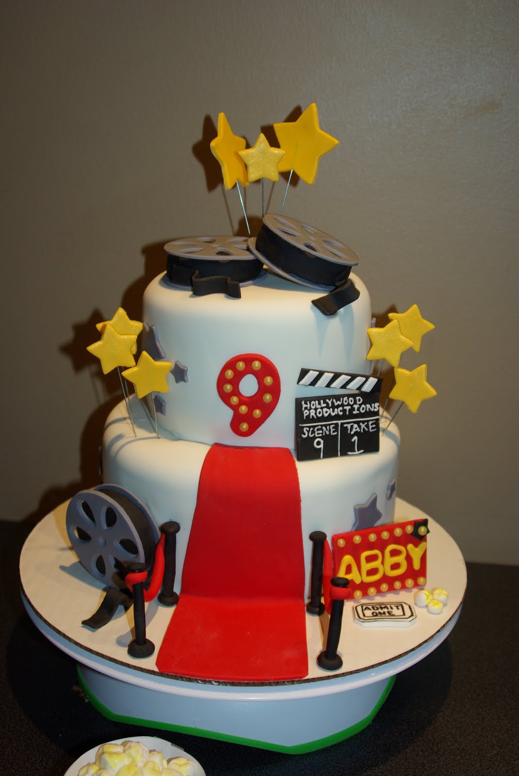 Ooh La La Cakes by Melissa: Movie theme cake with popcorn cupcakes