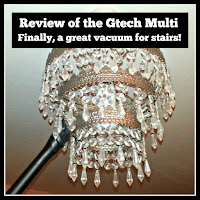 Dusting a chandelier with Gtech Multi