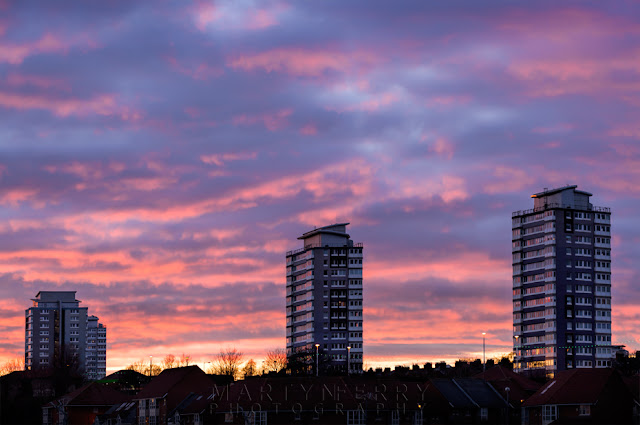 Sunset colours drift over high rise buildings in Sunderland on the north east coast