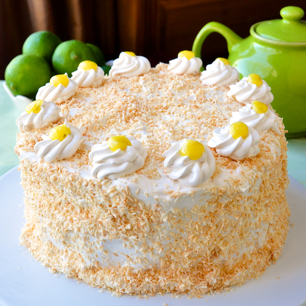  Coconut Lime Marshmallow Cake - a fantastic combination of flavors and textures including a light lime sponge cake, a tangy lime curd, fluffy marshmallow frosting and a generous coating of toasted coconut.