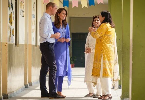 Kate Middleton wore a blue Kurta and trousers by Pakistani designer Maheen Khan and the Zeen earrings. Catherine Walker tunic