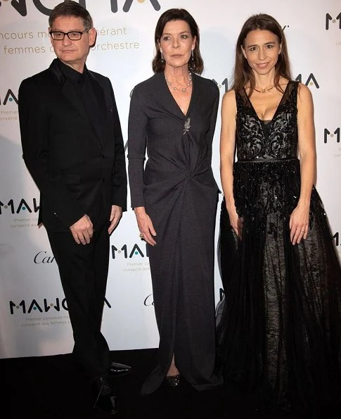 The Princess attend a party at Le Grand Hotel in Paris. Princess Caroline of Monaco wore a gray maxi dress by Prada