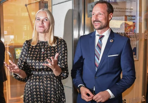 Crown Princess Mette-Marit wore a new satin midi dress by TiMo