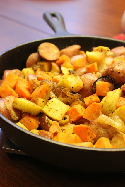 Easy, Healthy sweet potato and sausage skillet meal using chicken and apple sausage as meat option in the dish as well as butternut squash, apples, and onions.