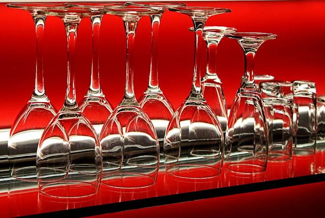 wine glasses on a glass shelf