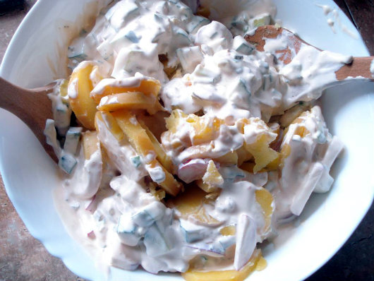stir the mayonnaise sauce into the potatoes