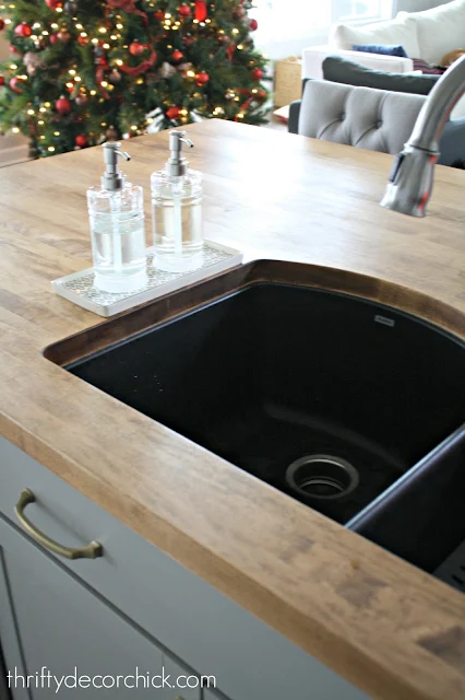 Black sink, wood countertops
