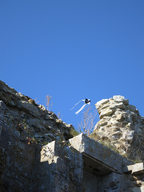 Kite with ghostly face flies above Sandsfooto Castle in Dorset.