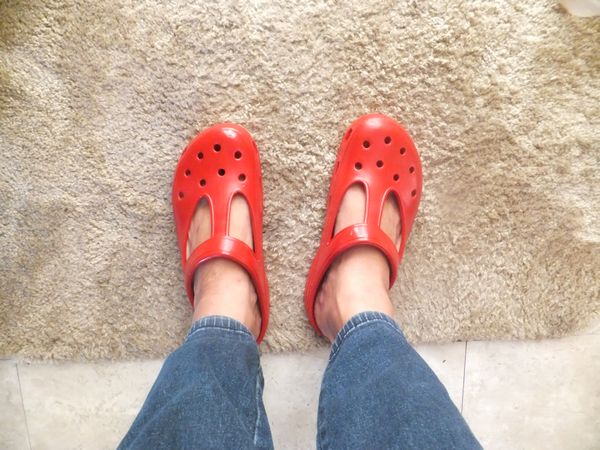 crocs with feet painted on them