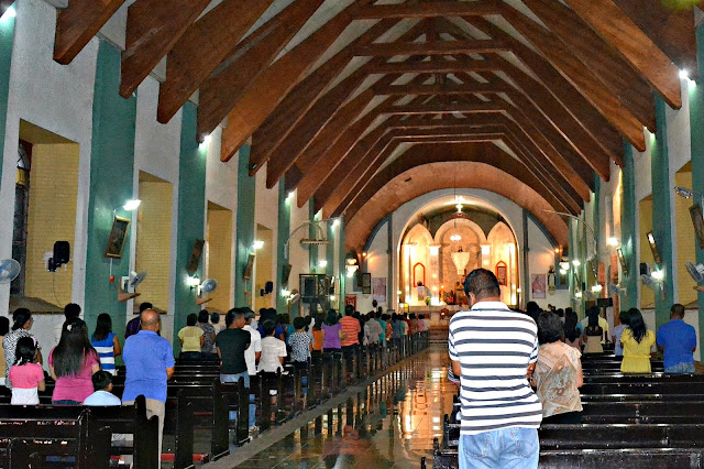 Attending mass inside the Lal-lo Church