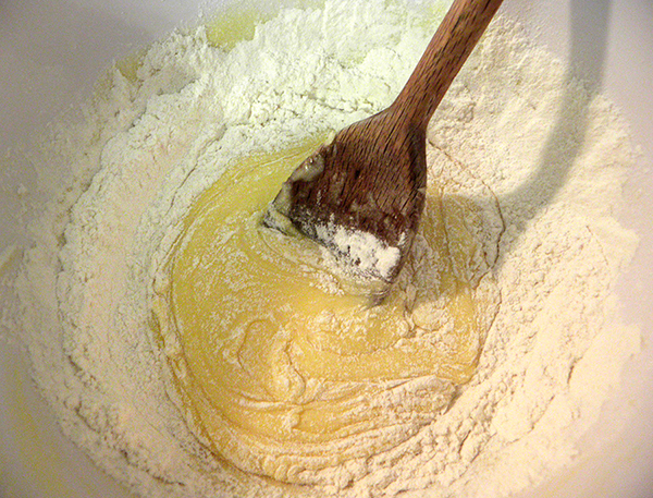 Stirring flour into batter