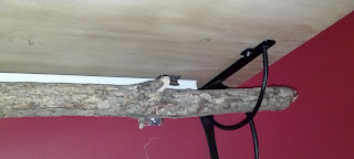 Place branch through bracket to create a curtain rod