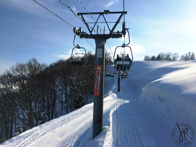 chairlifts, trees, thick snow