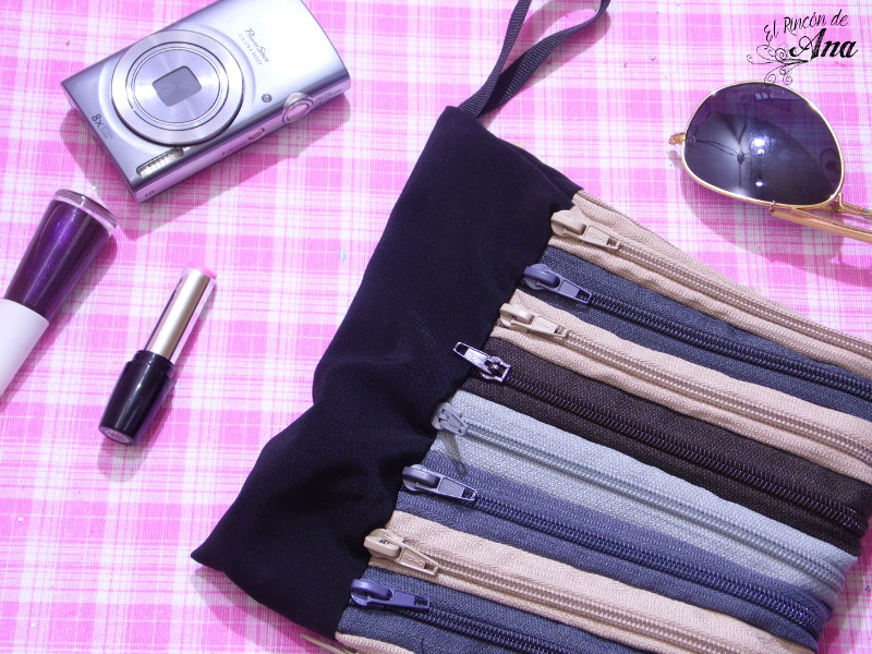 Bolso de mano con cierres