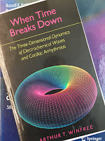 When Time Breaks Down, by Art Winfree, superimposed on Intermediate Physics for Medicine and Biology.