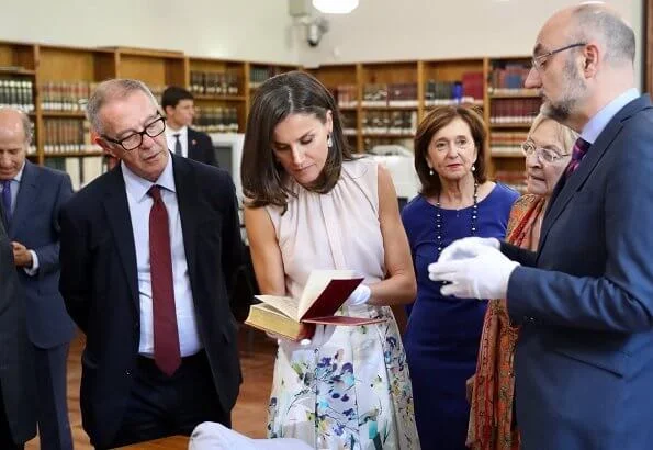 Queen Letizia wore Adolfo Dominguez floral print dress and Hugo Boss silk blouse, and Steve Madden pumps