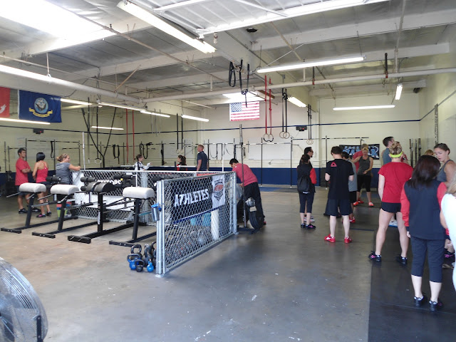 group of athletes standing around before a workout at CrossFit Marina 