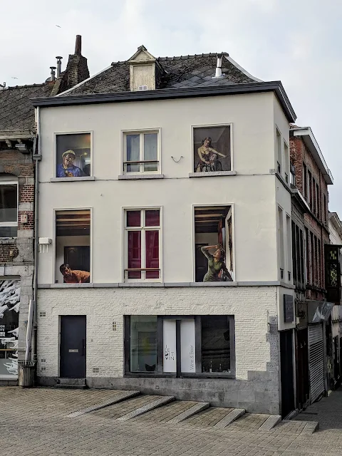 What to do in Mons Belgium: street art in building windows