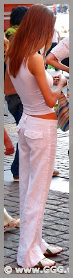 Lady in white pants on the street  