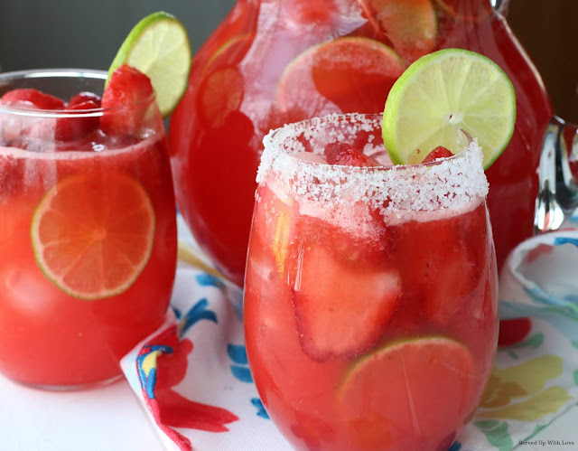 Strawberry Margarita Punch recipe with fresh strawberries and limes