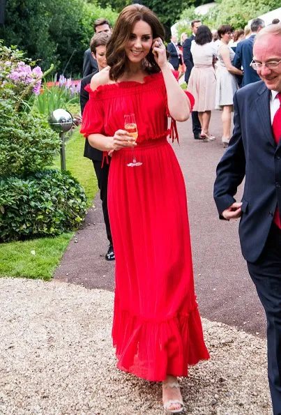 Kate Middleton's dress is by Alexander McQueen Off-the-shoulder shirred cotton and silk-blend. Simone Rocha Crystal earrings, Prada Pumps, Club Monaco Channon Heeled Sandal