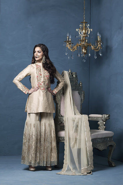 Influenced by timeless royal fashion, a straight dupion kurta with indian zardoze worn over shimmer sharara by Designer Rashi Kapoor Influenced by timeless royal fashion, a straight dupion kurta with indian zardoze worn over shimmer sharara by Designer Rashi Kapoor