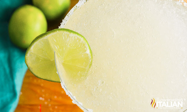 frozen margarita in a glass with salted rim