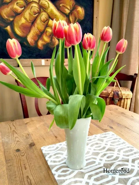 a vase of red tulips