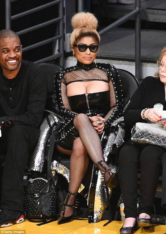 Nicki Minaj flashes cleavage in sexy black leather ensemble at Los Angeles Lakers game Nicki Minaj flashes cleavage in sexy black leather ensemble at Los Angeles Lakers game