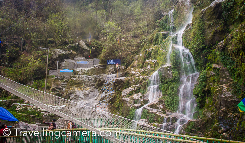 There are several magnificient waterfalls in Sikkim and the Seven Sister waterfall is one of them. Located around 32 kilometers from Gangtok, this waterfall is easily accessible from the Gangtok-Lachung highway. When we drove past these waterfalls, it was still summer and the water was comparatively less, but it is said that during the rains, these waterfalls are a sight to see.   From a distance from certain points each of the seven different waterfalls is visible, falling almost parallel to each other, down the rugged face of the mountain. Some of the falls turn to almost a trickle in the summer, while others hide behind the rocks, but overall, the falls are worth a stop and some photos even at the driest times.   During monsoon, you can spend more time here. Anyways, we feel Sikkim is a place you should go with loads of time on your hands, because there's a risk that you will fall in love with a small town or a city and would want to spend more time there. We tried to be flexible during our trip and it works.   When we were on our trip, we met several people simply because we were riding the public transport most of the time. Among the people we met was a Russian national who had taken up a job in Infosys in Hyderabad and had been staying here for several years simply because he wanted to see India and what could be better if you could do it while getting paid well. Sikkim is the ideal place for such a guy, because he takes long vacations from his company and usually visits a place with the intention of exploring it. He had arrived in Gangtok and rented a very cheap hotel so that he could stay longer. And he would plan each day as it came.   It is these kinds of people who would get the most from visiting a place like Sikkim. But a majority of tourists in Sikkim are families. We found several of them at Seven Sister Waterfalls as well. They usually come here on a tight schedule and leave after the quintessential selfies with their feet dipped in the pool. Nothing wrong with that of course. It is anyways very difficult to really experience anything when it is too crowded. To each his/her own.   Tourists do not visit the Seven Sisters Waterfalls in isolation. They usually stop here on their way to somewhere else. It is usually a circuit. Along with the Seven Sisters Waterfalls, people visit hilltop temples known as Hanuman Tok and Ganesh Tok, the Himalayan Zoological park where you can see the red panda. People also stop on their way to look at Banjhakri waterfall and the Bakthang Waterfalls. Tourists also flow in and out of the Namgyal Institute of Tibetology. It is usually a full-day circuit. We also did something of the sort on a taxi we shared with the Russian.   The best time to visit the falls is during the monsoons when the falls are mighty and unstoppable. If you have time on your hands, you can sit around and soak in the sights, may be take a much needed break from a hectic touristy schedule. 