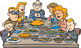 Clipart image of a family saying grace at the Thanksgiving table