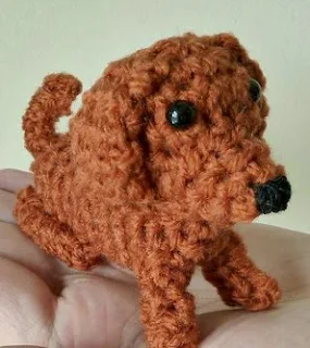 http://www.craftsy.com/pattern/crocheting/toy/teeny-tiny-daschund-amigurumi/104315