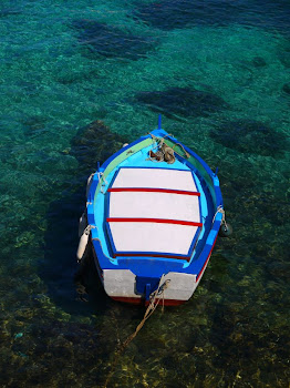 Lone Boat Amidst Crystal Blue-Green Waters