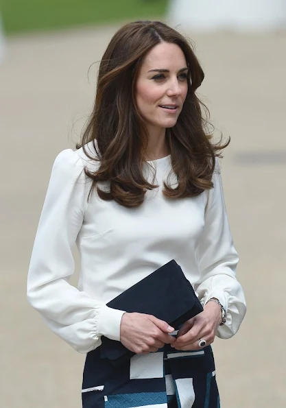 Kate Middleton, Prince William, and Prince Harry attend the official launch of Heads Together. Duchess Catherine wears Banana Republic Geo Jacquard Skirt