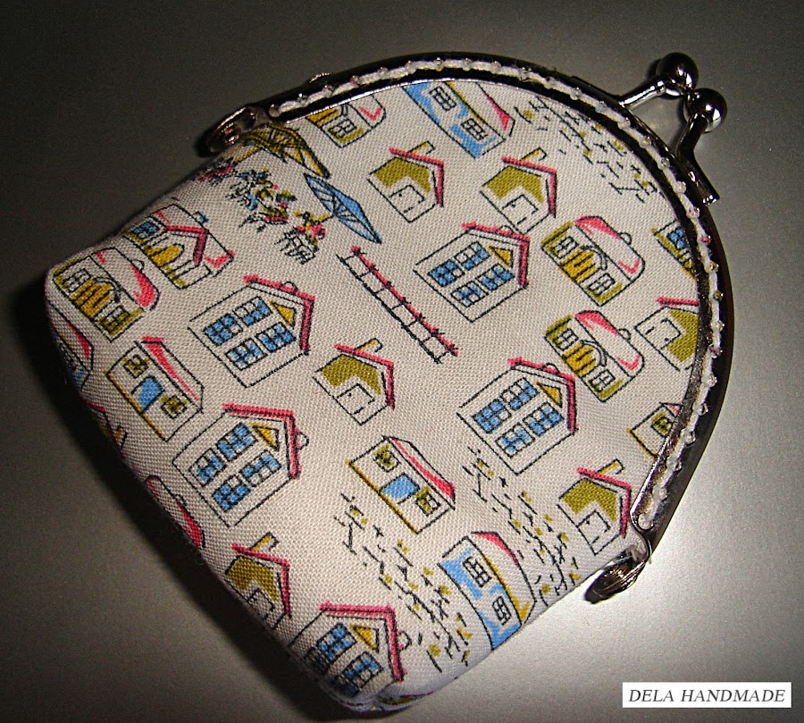 <img src="Monedero-de-boquilla.jpg" alt="Monedero de boquilla hecho a mano">