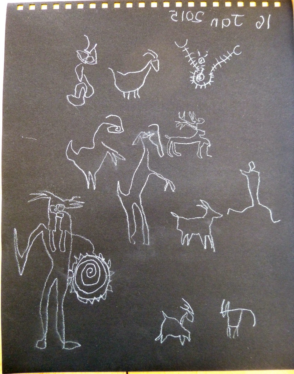 Rock art white on black drawn with left hand whilst drawing...