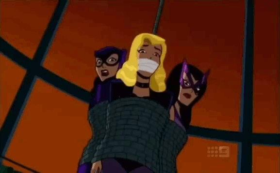 The Birds of Prey are all strung up above a shark tank, but Black Canary is...