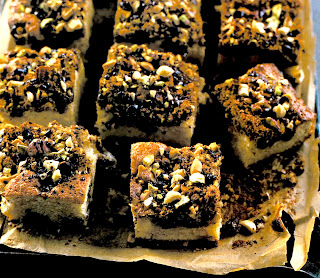 Crumbly Cinnamon and Chocolate Squares: White sponge traybake with a chocolate, nut and cinnamon topping that's cut into squares before serving