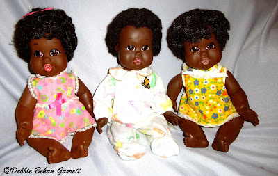 A picture of three Baby Nancy dolls