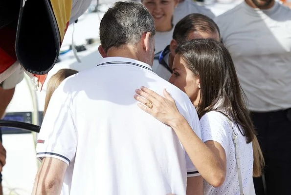 Queen Letizia wore Adolfo Dominguez embroidered cotton dress and Mint & Rose shoes.Crown Princess Leonor and Infanta Sofia